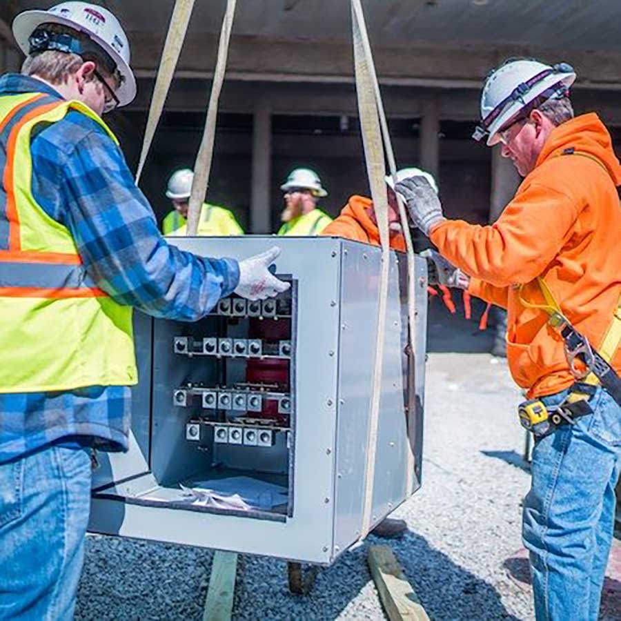 Commercial Torgeson Electric employees working on electrical paneo project